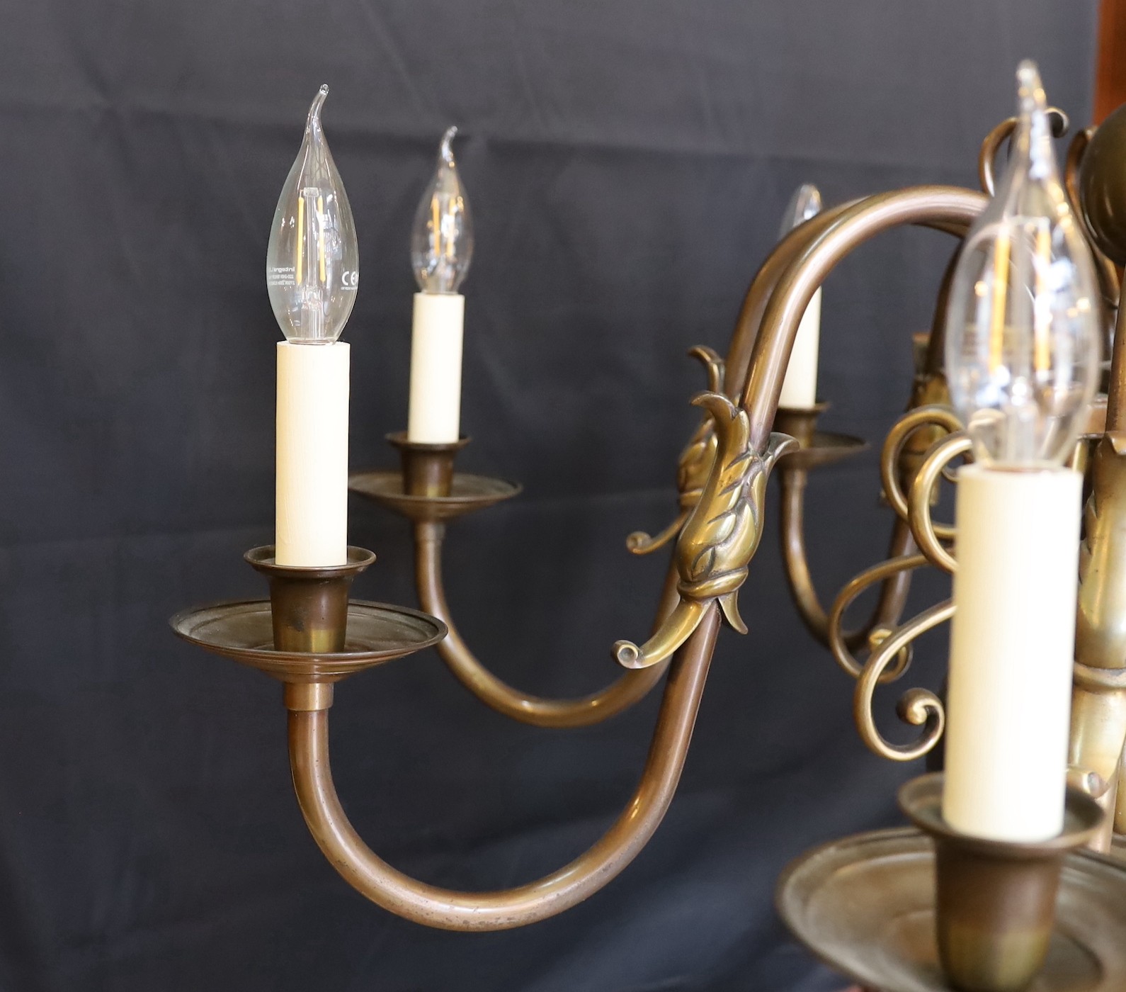 A large Dutch bronzed brass eight light chandelier, drop 70cm. width 86cm